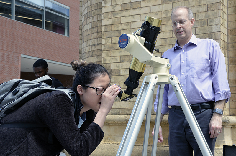 Students observe sun spots during PHYS 131.